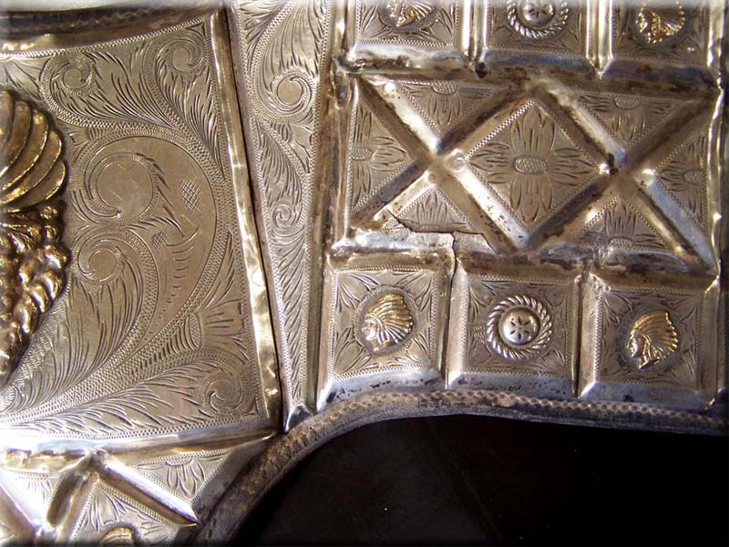 An example of the many cracks throughout all the silver plates. All cracks were then hard soldered and dents straightened